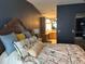 Comfortable main bedroom with a decorated bed, leading to the ensuite bathroom at 503 Tivoli Park Dr, Davenport, FL 33897