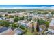 Expansive aerial view of a residential neighborhood featuring mature trees and well-maintained homes at 521 Rena Dr, Davenport, FL 33897