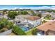 Aerial view of a home with a screened pool and well-maintained backyard in a suburban setting at 521 Rena Dr, Davenport, FL 33897