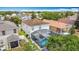 Aerial view of a property featuring a private screened pool and a charming backyard at 521 Rena Dr, Davenport, FL 33897
