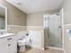 This bathroom features a glass shower enclosure, a soaking tub and an updated vanity at 521 Rena Dr, Davenport, FL 33897