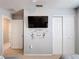 Comfortable bedroom boasts a themed wall, ceiling fan, and access to another room at 521 Rena Dr, Davenport, FL 33897