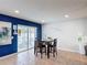 Inviting dining area with a table set for four, sliding glass doors, and a serene view of the outdoors at 521 Rena Dr, Davenport, FL 33897