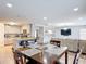Dining area view showing connection to a modern kitchen and comfortable living space, great for entertaining at 521 Rena Dr, Davenport, FL 33897