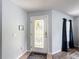 Welcoming foyer showcasing a decorative glass front door and ceramic flooring at 521 Rena Dr, Davenport, FL 33897