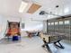 The garage features a ping pong table, foosball table, basketball game and epoxy flooring at 521 Rena Dr, Davenport, FL 33897