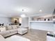 Open-concept living area with seamless integration to the dining and kitchen spaces for modern living at 521 Rena Dr, Davenport, FL 33897