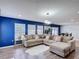 Spacious living room featuring a comfortable sectional sofa, stylish lighting, and plenty of natural light at 521 Rena Dr, Davenport, FL 33897