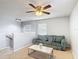 Open loft area with a comfy sofa, a modern coffee table, and natural light at 521 Rena Dr, Davenport, FL 33897