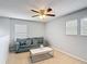 Cozy loft area features a comfortable couch and a modern coffee table at 521 Rena Dr, Davenport, FL 33897