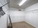 The walk-in closet has carpet flooring, wire shelving, and ample storage space at 521 Rena Dr, Davenport, FL 33897