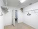 The walk-in closet has carpet flooring, and wire shelving, and also leads to the main bedroom at 521 Rena Dr, Davenport, FL 33897
