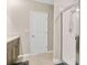 Well-lit bathroom features a walk-in shower with glass doors and neutral tile flooring at 527 Amadoras Way, St Cloud, FL 34771