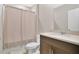 Bathroom featuring a single sink vanity and tub with shower curtain at 527 Amadoras Way, St Cloud, FL 34771