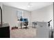 Bedroom featuring a desk setup, neutral walls, and a ceiling fan at 527 Amadoras Way, St Cloud, FL 34771