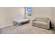 Cozy bedroom featuring neutral carpet, a twin daybed and a comfortable couch at 527 Amadoras Way, St Cloud, FL 34771