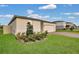Low angle of this home with a brick driveway, well maintained landscaping and a front two car garage at 527 Amadoras Way, St Cloud, FL 34771