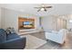 Spacious living room featuring a modern entertainment center and plenty of natural light at 527 Amadoras Way, St Cloud, FL 34771