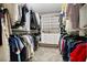 Spacious walk-in closet with extensive shelving, drawers, and hanging storage at 527 Amadoras Way, St Cloud, FL 34771