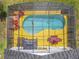 From above, the screened-in pool area offers a private retreat, complete with outdoor seating and a tranquil atmosphere at 550 Canary Island Cir, Davenport, FL 33837