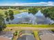 Enjoy scenic views from above, overlooking a serene pond, lush golf course, and the neighborhood's screened-in pools at 550 Canary Island Cir, Davenport, FL 33837