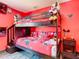 Vibrant bedroom with a bunk bed and Mickey Mouse-themed decor creates a playful atmosphere at 550 Canary Island Cir, Davenport, FL 33837