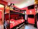 themed bedroom featuring a bunk bed, TV and fun décor at 550 Canary Island Cir, Davenport, FL 33837