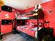 themed bedroom featuring a bunk bed, TV and fun décor at 550 Canary Island Cir, Davenport, FL 33837
