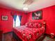 Bedroom featuring Disney-themed bedding, light fixture and decor at 550 Canary Island Cir, Davenport, FL 33837