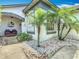 Inviting front entrance with seating and lush landscaping, creating a welcoming ambiance at 550 Canary Island Cir, Davenport, FL 33837