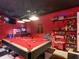 Fun game room boasts a pool table, popcorn machine, and gaming machines for hours of entertainment at 550 Canary Island Cir, Davenport, FL 33837