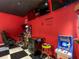 Fun game room featuring arcade games and a comfortable gaming chair for immersive play at 550 Canary Island Cir, Davenport, FL 33837
