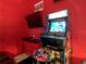 A fantastic game room with a Karaoke sign, large-screen tv, and arcade games at 550 Canary Island Cir, Davenport, FL 33837