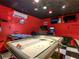 Game room showcasing an air hockey table and more, creating a fun entertainment space at 550 Canary Island Cir, Davenport, FL 33837