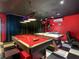 Enjoy dual game tables for air hockey and pool in this fun recreational game room at 550 Canary Island Cir, Davenport, FL 33837