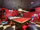 Spacious game room featuring a pool table and air hockey table offers endless entertainment possibilities at 550 Canary Island Cir, Davenport, FL 33837
