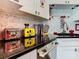 Kitchen features sleek black countertops, stainless steel appliances, and modern mosaic backsplash at 550 Canary Island Cir, Davenport, FL 33837