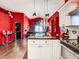 Open kitchen and living area featuring granite countertops, a chandelier, and open floor plan at 550 Canary Island Cir, Davenport, FL 33837