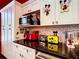 Modern kitchen features sleek black countertops, stainless steel appliances, and ample cabinet space at 550 Canary Island Cir, Davenport, FL 33837