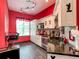 Modern kitchen with black countertops, stainless appliances, and bright lighting fixtures at 550 Canary Island Cir, Davenport, FL 33837