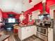 Well-equipped kitchen with modern appliances and cabinetry, open to a dining and living area at 550 Canary Island Cir, Davenport, FL 33837