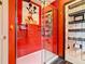 Shower featuring a Mickey Mouse design in tile and a modern shower panel with body jets at 550 Canary Island Cir, Davenport, FL 33837