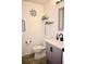 Cozy half-bathroom showcasing stylish nautical themed decorations, updated vanity and fixtures at 673 Sarner Pass Way, Winter Haven, FL 33881