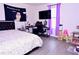 Bedroom with modern furniture, a black desk and a TV on the wall at 673 Sarner Pass Way, Winter Haven, FL 33881