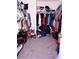 Walk-in closet featuring ample storage space for clothing and shoes at 673 Sarner Pass Way, Winter Haven, FL 33881