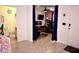 Open interior shot with tile floors, and adjacent bathroom and study with exercise equipment at 673 Sarner Pass Way, Winter Haven, FL 33881
