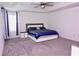 Spacious primary bedroom with tray ceiling, neutral decor, and modern furnishings at 673 Sarner Pass Way, Winter Haven, FL 33881