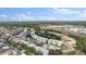 An aerial view of the community buildings, landscaping, and nearby roadways offering convenience and serenity at 7509 Mourning Dove Cir # 303, Reunion, FL 34747