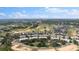 An aerial view showing the community, golf course, and surrounding landscape at 7509 Mourning Dove Cir # 303, Reunion, FL 34747