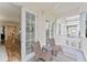 Balcony with woven chairs and views into the home at 7509 Mourning Dove Cir # 303, Reunion, FL 34747
